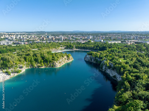 Wallpaper Mural Zakrzówek, Krakow, Poland. Swimming pools, sunbathing platforms and paddling area on Zakrzowek lake with steep cliffs in place of flooded limestone quarry. Public recreational place. Aerial view Torontodigital.ca