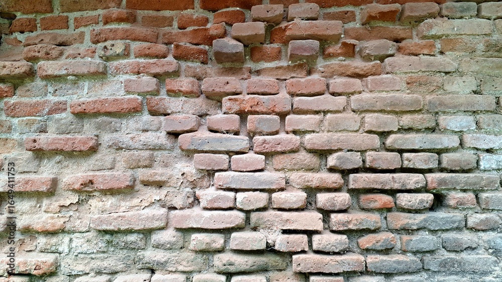 Naklejka premium Classic Red Brickwork with Visible Mortar Lines, Solid Construction Material for Backdrops, Textures, and Design Elements in Various Projects