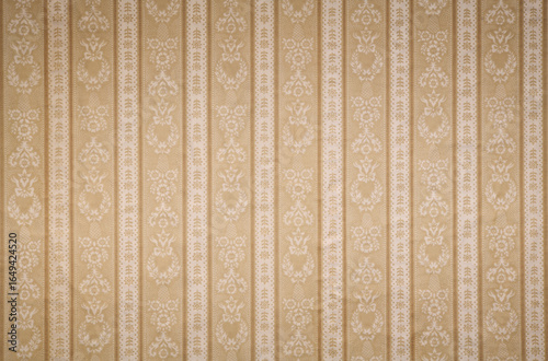 Old wallpaper on the wall. Old wallpaper for texture or background.