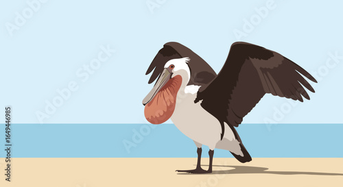 A majestic pelican with outstretched wings stands on a sandy beach near the ocean under a clear blue sky