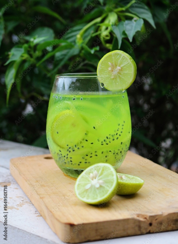 Fototapeta premium Es kuwut. A drink made from young coconut water and lime originated from Bali, Indonesia.