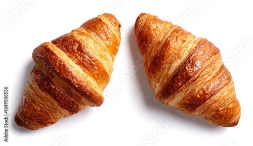 Two golden-brown croissants, top-down view (1)