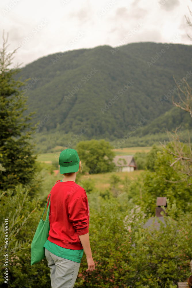 Naklejka premium young man walking in the mountains