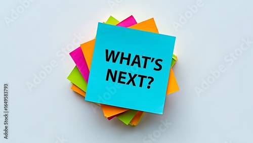 Stack of colorful sticky notes with what's next question on top