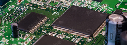 Картината върху платно Close view of a circuit board highlighting integrated circuits and solder points