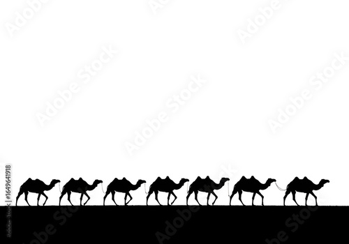 A caravan of camels in silhouette against a vibrant sunset sky over the desert sand dunes