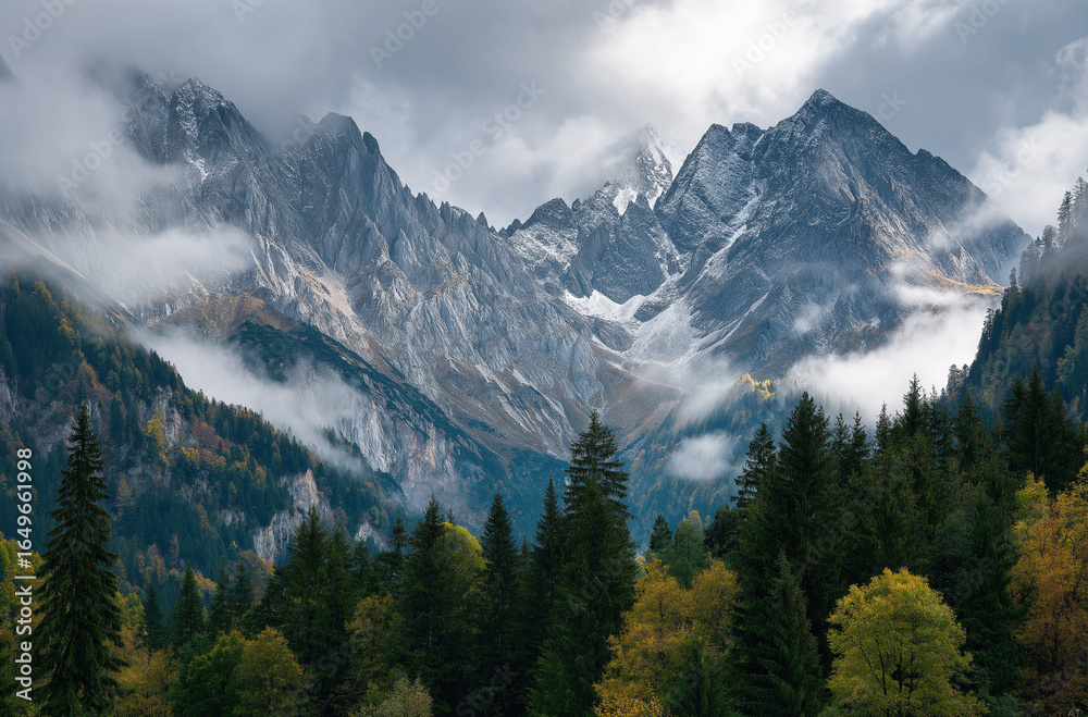 Fototapeta premium A panoramic view of the Triglav mountain range in the surroundings of Slon, with rocks and mists creating an atmosphere of mystery and grandeur,