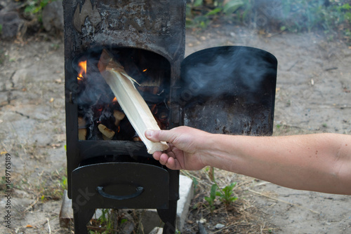 man working with firewood in the garden