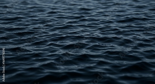 Low Angle View of Dark Choppy Water Ripples on Deep Ocean Surface for Dramatic Marine Background