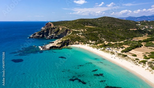 Pristine beach and turquoise waters seen from above.