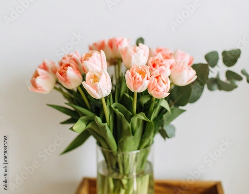 Bouquet of pink tulips in a glass vase
