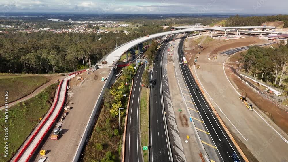 Aerial drone view above the M7-M12 Interchange at Cecil Hills, Western Sydney, NSW Australia on a sunny morning in August 2025 Aerial drone view above the M7-M12 Interchange at Cecil Hills, Western Sydney, NSW Australia on a sunny morning in August 2025