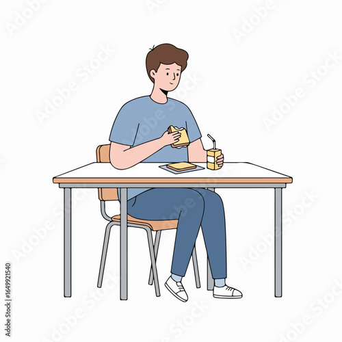 Young person sitting at a desk enjoying a casual meal with a sandwich and a drink during a break.