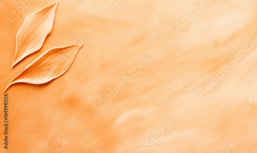Two stylized, leaf-like shapes are positioned diagonally against an abstract, textured orange background reminiscent of a painted canvas. The light catches the edges, creating a sense of depth