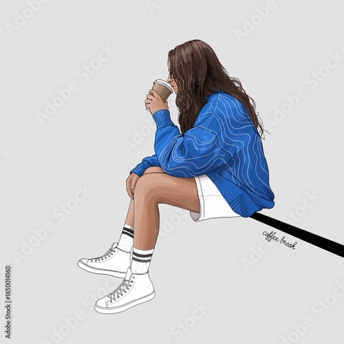 A young woman enjoys a cozy coffee break, seated casually while sipping from a cup, embodying a relaxed and trendy style that resonates with comfort and leisure.