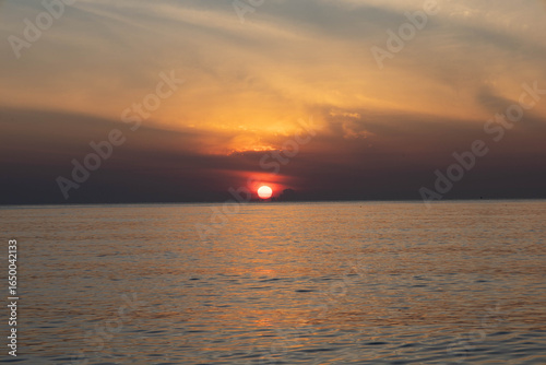Beautiful sunset on the sea beach with coconut tree for travel in holiday