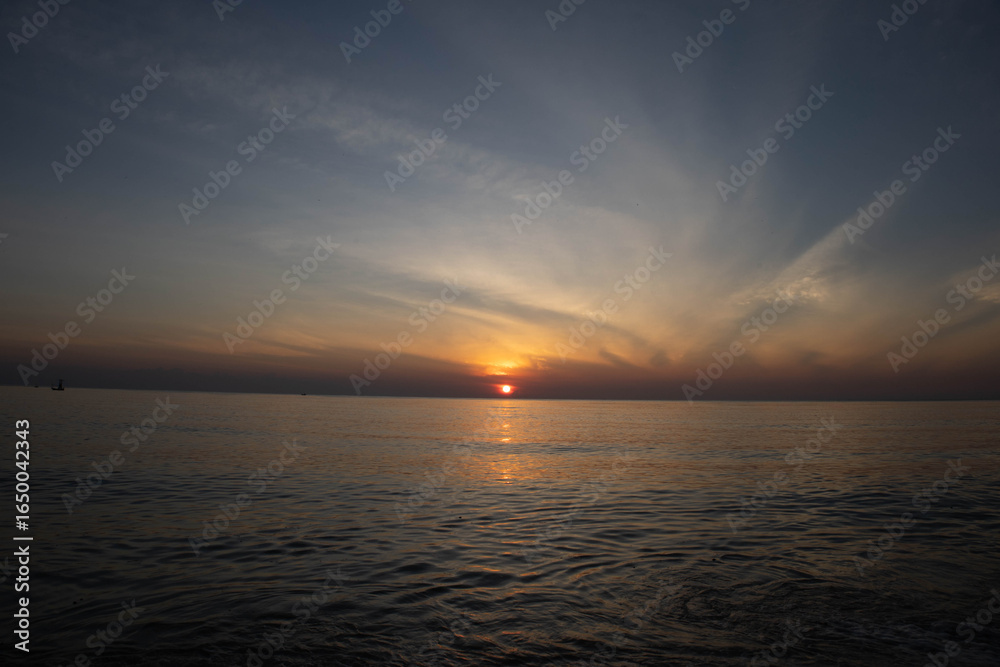 Beautiful sunset on the sea beach with coconut tree for travel in holiday Beautiful sunset on the sea beach with coconut tree for travel in holiday