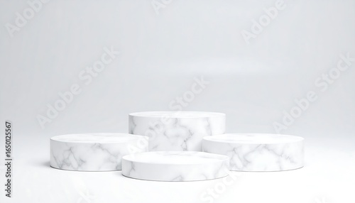 Four white marble podiums