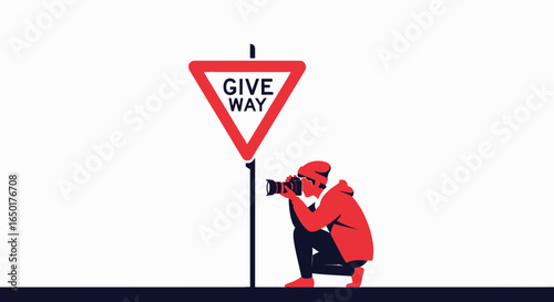 Photographer Capturing the Moment Near a Red and White Give Way Sign