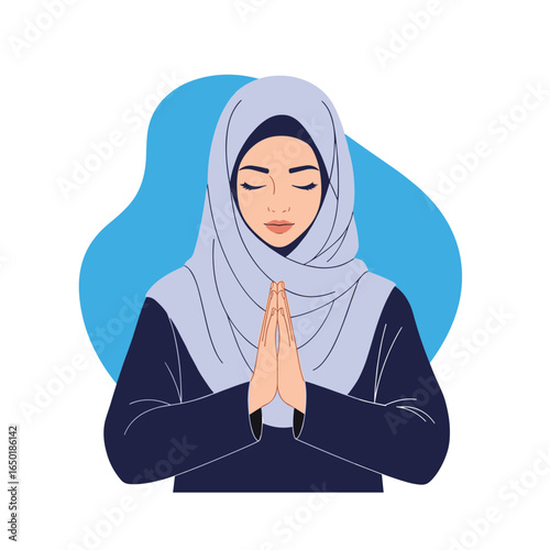 Woman in a hijab praying with eyes closed palms together reverence