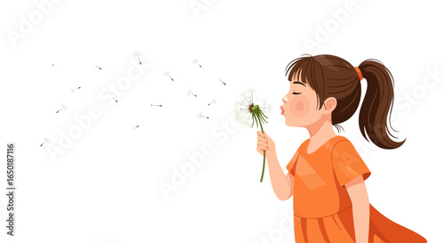 A young girl with a ponytail in an orange dress blows on a dandelion, scattering its seeds.
