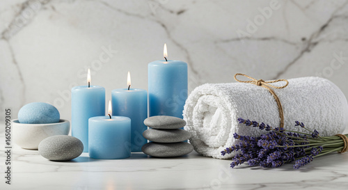 Spa wellness still life with candles towel lavender and stones for relaxation
