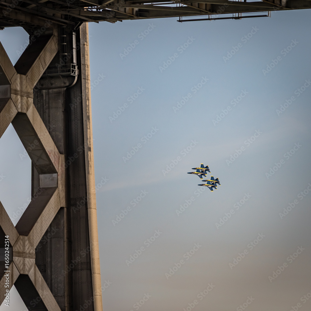 Vibrant Blue Jet in aerial display over bridge Vibrant Blue Jet in aerial display over bridge