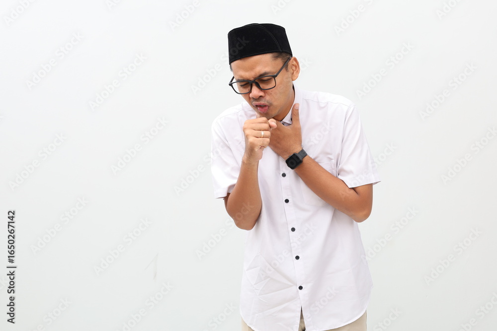 Asian muslim man having sore throat and touching his neck. Isolated on white background Asian muslim man having sore throat and touching his neck. Isolated on white background