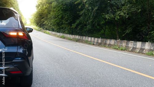 Φωτογραφία Rear side of dark blue car with turn light signal