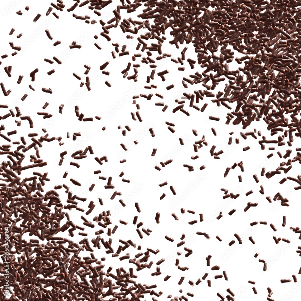 Fototapeta premium Scattered brown, rod-shaped particles against a black background.