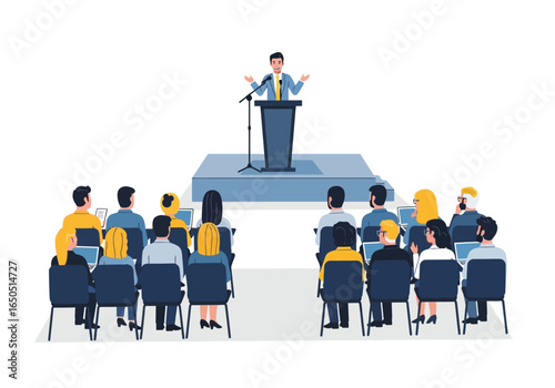 Speaker presenting to an audience in chairs on laptops