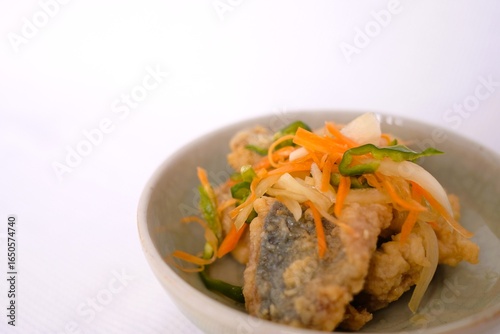 Nanbanzuke , Fried horse mackerel marinated in sweet and spicy vinegar. 
