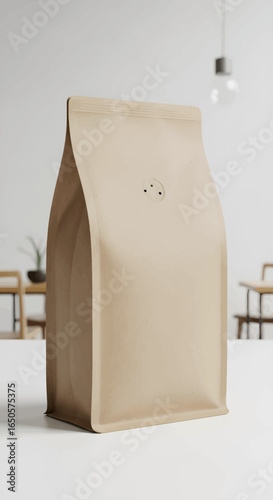 Unbranded light brown paper coffee bag with a degassing valve standing upright.