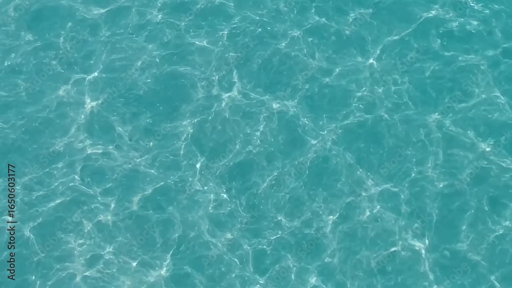Turquoise water surface with shimmering bright refractions Turquoise water surface with shimmering bright refractions