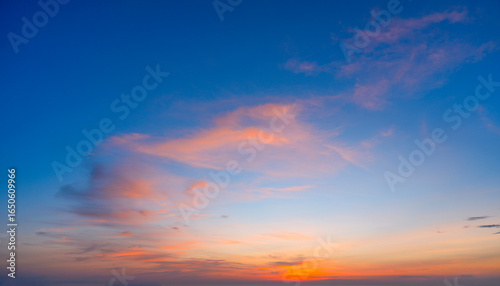 Canvas Print Radiant pink, orange, and blue clouds are scattered across the sky during the evening