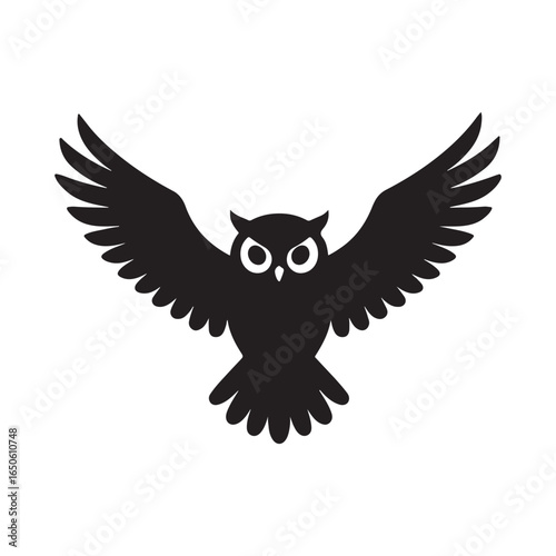 Black owl silhouette with wings spread wide in flight