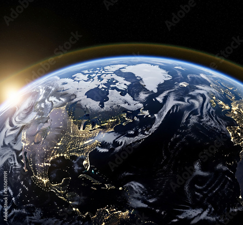 An ultra-realistic view of Earth from space, showing illuminated continents, glowing city lights, and swirling clouds over the oceans. The curvature of the Earth visible, with the Sun rising over the 