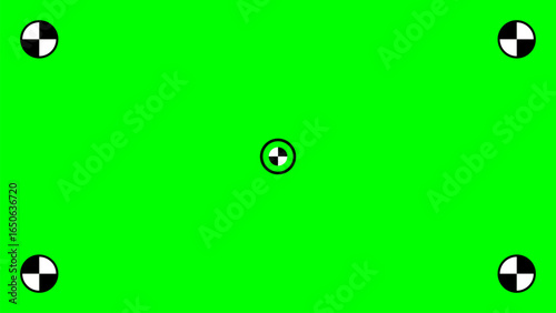 bright green screen background with five black and white tracking markers, one centered and one in each corner, easy chroma keying and digital content replacement in video editing and post production