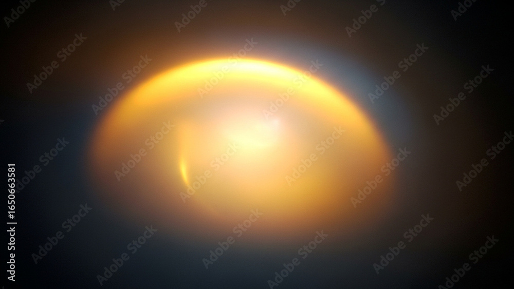 Obraz premium Golden orb abstract light effect against dark background showcasing luminous glow