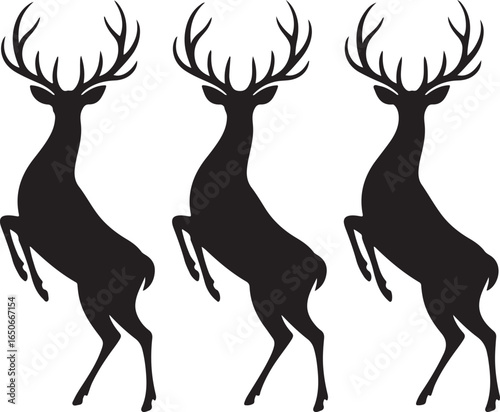 Three Black Silhouette Deer Standing on Hind Legs with Antlers animal wildlife