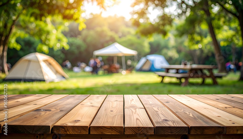Wooden Table In The Foreground With Blurred Camping Site And Park Background During The Sunny Day