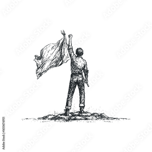 Man raising flag on rocky terrain in victory pose