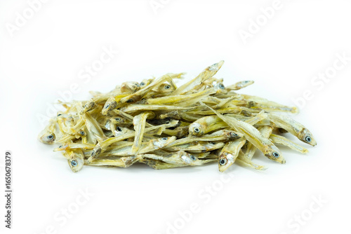 Sun dried minnow fish isolated on white background close up stack, small freshwater fish
