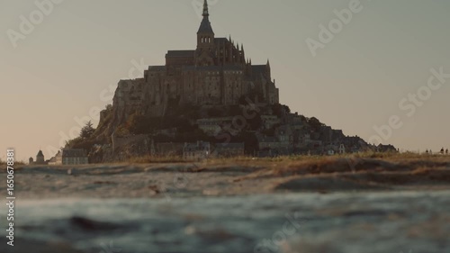 Mont Saint Michel at sunset in Normandy France, historic castle landmark island