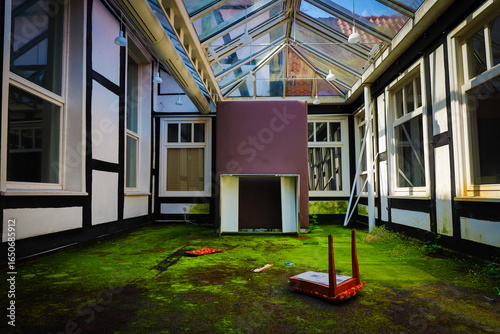 overgrown winter garden of a lost place hotel