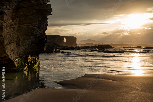 Dramatic Sunset at Playa de las Catedrales: Iconic Rock Formations and Golden Hour Light