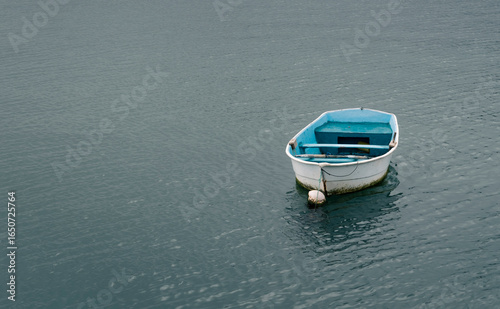 Blue Boat on Calm Ocean - Coastal Reflection Spain