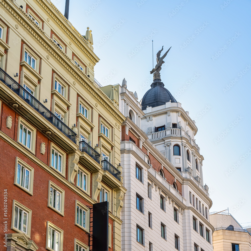 Fototapeta premium Emblematic buildings of the Gran Via in Madrid in neoclassical style, Spain.