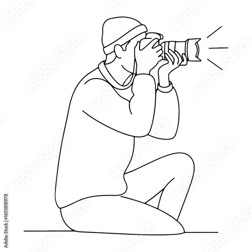 Nature and Event Photography: A person taking a low-angle shot, which can be used for fields such as event, sports, or wildlife photography.