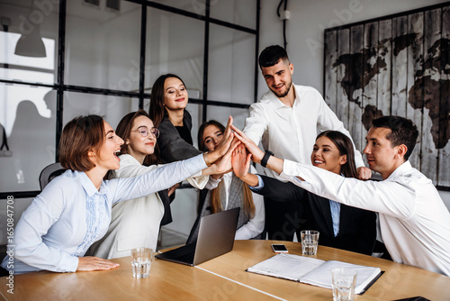 Group of people working out business plan in an office